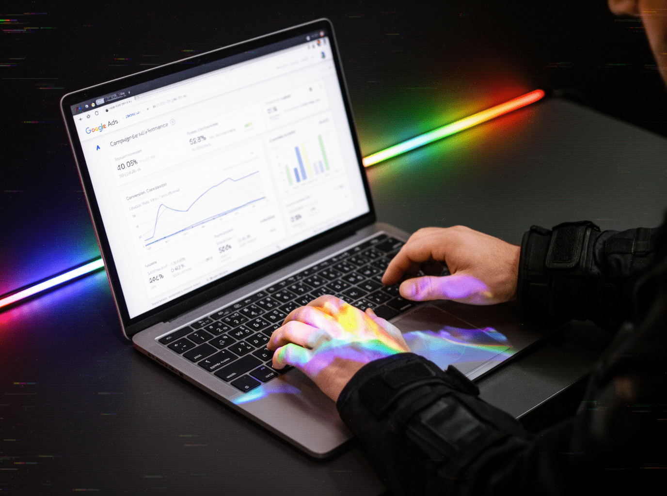 A man on a laptop using Google Analytics for Google Ads conversion tracking